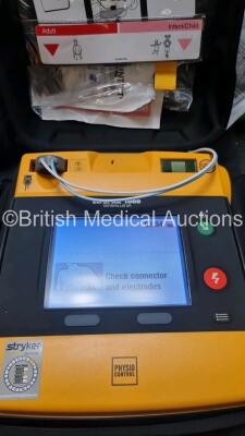 2 x Medtronic Physio Control Lifepak 1000 Defibrillators *Mfd 2016 / 2018* (Both Power Up) with 2 x 3 Lead ECG Lead , 3 x in Date Electrode Packs and 3 x Physio Control 1000 Batteries *Li/Mn02* - 2