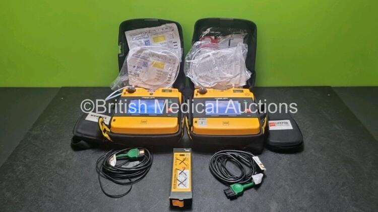 2 x Medtronic Physio Control Lifepak 1000 Defibrillators *Mfd 2016 / 2014* (Both Power Up) with 2 x 3 Lead ECG Lead , 4 x in Date Electrode Packs and 3 x Physio Control 1000 Batteries *Li/Mn02*