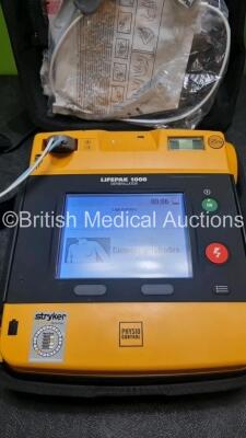 2 x Medtronic Physio Control Lifepak 1000 Defibrillators *Mfd 2016 / 2014* (Both Power Up) with 2 x 3 Lead ECG Lead , 5 x in Date Electrode Packs and 4 x Physio Control 1000 Batteries *Li/Mn02* - 6