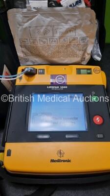 2 x Medtronic Physio Control Lifepak 1000 Defibrillators *Mfd 2016 / 2008* (Both Power Up) with 2 x 3 Lead ECG Lead , 4 x in Date Electrode Packs and 3 x Physio Control 1000 Batteries *Li/Mn02* - 2