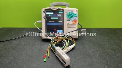 Philips Heartstart MRx Defibrillator Including Pacer, ECG and Printer Options with 1 x 3 Lead ECG Lead, 1 x Paddle Lead, 1 x M3539A Module, 1 x M3538A Battery and 1 x Philips M3725A Test Load (Powers Up with Device Error-See Photo)