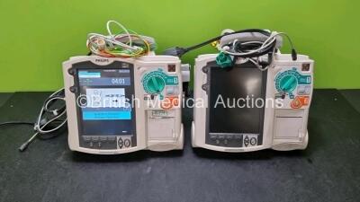 2 x Philips MRx Heartstart Defibrillators Including Pacer, ECG and Printer Options (Both Power Up) with 2 x 3 Lead ECG Leads, 2 x Paddle Leads and 1 x M3538A Module