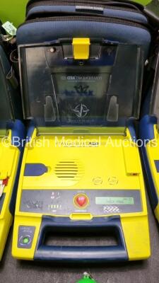 3 x Cardiac Science Powerheart AED G3 Automated External Defibrillators (All Power Up with Stock Battery Stock Battery Not Included) In Carry Case with 3 x In Date Electrode Packs and 1 x Ambu Res Cue Mask - 3