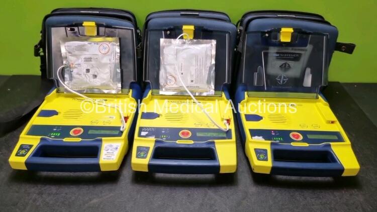 3 x Cardiac Science Powerheart AED G3 Automated External Defibrillators (All Power Up with Stock Battery Stock Battery Not Included) In Carry Case with 2 x In Date Electrode Packs