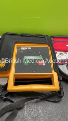 Job Lot Including 1 x Medtronic Lifepak 500 Defibrillator (Shutter Clip Broken) and 1 x Saverone Defibrillator In Carry Case (Both No power Suspected Flat Batteries) - 2