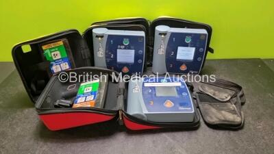 3 x Laerdal Heartstart FR2 Defibrillators (All Power Up with Stock Batteries, Batteries Not Included) In Carry Cases