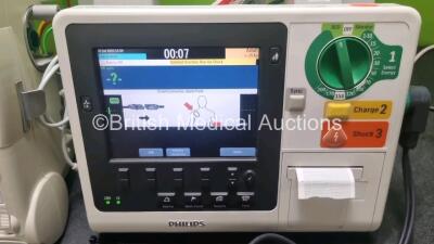 Job Lot Including 1 x Philips Heartstart MRx Defibrillator Including Pacer, ECG and Printer Options with 1 x Paddle Lead, Paddle Dock , 1 x M3538A Battery and 1 x Philips M3539A Module and 1 x 3 Lead ECG Lead (Powers Up) and 1 x Philips Heartstart XL+ De - 2