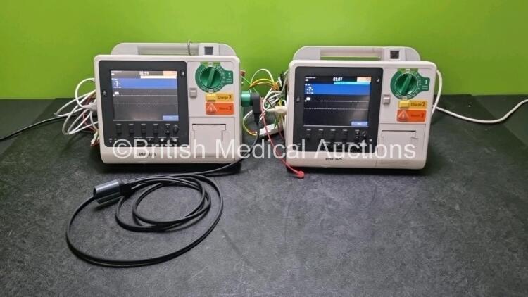 2 x Philips Heartstart XL+ Defibrillators (Both Power Up) Including ECG and Printer Options with 2 x ECG Lead and 1 x Paddle Leads