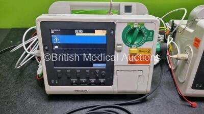 2 x Philips Heartstart XL+ Defibrillators (Both Power Up) Including ECG and Printer Options with 2 x ECG Lead and 1 x Paddle Leads - 3