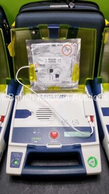 3 x Cardiac Science Powerheart AED G3 Automated External Defibrillators (All Power Up with Stock Battery Stock Battery Not Included) In Carry Case with 3 x In Date Electrode Packs - 3