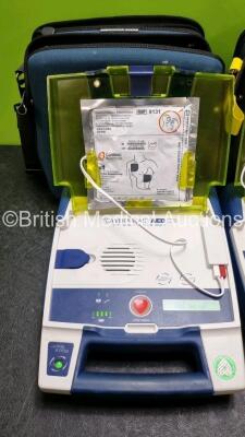 3 x Cardiac Science Powerheart AED G3 Automated External Defibrillators (All Power Up with Stock Battery Stock Battery Not Included) In Carry Case with 3 x In Date Electrode Packs - 4