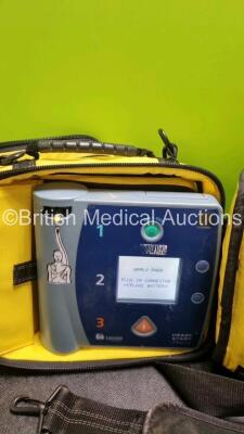 3 x Laerdal Heartstart FR2+ Defibrillators (All Power Up with Stock Batteries, Batteries Not Included) In Carry Cases - 4