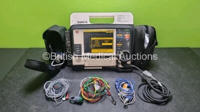 Medtronic Lifepak 12 Biphasic Defibrillator *Mfd 2001* P/N VLP12-02-002132 (Powers Up and Passes Self Test) Including ECG, SpO2, NIBP Options with 1 x Ref 1111-000021 4 Lead ECG Lead, 1 x Ref 11111-000023 6 Lead ECG Lead, 2 x Batteries, 1 x Paddle Lead, 1