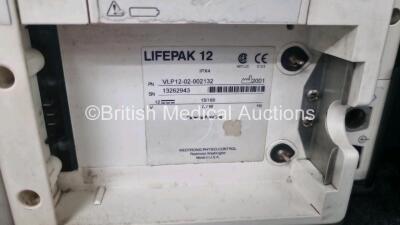 Medtronic Lifepak 12 Biphasic Defibrillator *Mfd 2001* P/N VLP12-02-002132 (Powers Up and Passes Self Test) Including ECG, SpO2, NIBP Options with 1 x Ref 1111-000021 4 Lead ECG Lead, 1 x Ref 11111-000023 6 Lead ECG Lead, 2 x Batteries, 1 x Paddle Lead, 1 - 8