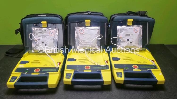 3 x Cardiac Science Powerheart AED G3 Automated External Defibrillators (All Power Up with Stock Battery, Battery Not Included) with 3 x In Date Electrode Pack