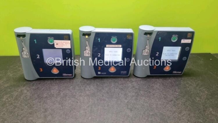 Job Lot Including 2 x Laerdal Heartstart FR2 Defibrillators and 1 x Laerdal Heartstart FR2+ Defibrillator (All Power Up) with 3 x Philips M3863A Battery *Install Before 2020 / 2023*