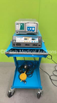 Covidien Force FX Electrosurgical / Diathermy Generator on Trolley with 2 x Footswitches and 1 x Viro Vac Surgical Smoke Evacuation Unit (Powers Up with Damaged Smoke Evacuation Unit Casing-See Photos) *SN V06252, F7K4493A*