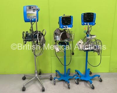 Job Lot Including 2 x GE Dinamap V100 Patient Monitors on Stands with 2 x NIBP Hoses, 2 x BP Cuffs and 2 x SpO2 Finger Sensors and 1 x GE Dinamap GE PRO 300 Patient Monitor in Stand with 1 x NIBP Hose and 1 x SpO2 Finger Sensor and BP Cuff (All Power Up) 