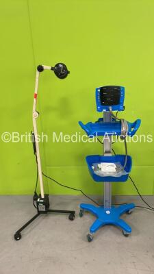 Mixed Lot Including 1 x GE Dinamap V100 Patient Monitor on Stand with 4 x NIBP Hoses and 1 x AC Power Supply (No Power) 1 x Daray Light on Stand (No Power) *SN SH614130346SA, NA*