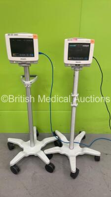 2 x Philips IntelliVue MP5 Patient Monitors on Stands (Both Power Up) *S/N DE70402527 / DE74807480*