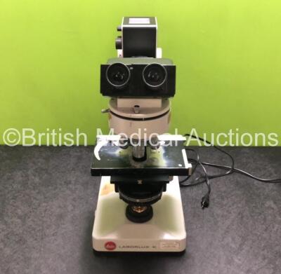 Leitz Laborlux K Benchtop Microscope with 2 x 10x/18 Eyepieces, 1 x Leitz EF 100/1.25 OEL Optic, 1 x Leitz Plan 40/0.65 Phaco 2 Optic, 1 x Leitz EF 25/0.50 Optic and 1 x Leitz 25/0.50 Phaco 2 Optic (Powers Up with Good Bulb)