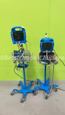 2 x GE Dinamap Procare Auscultatory Patient Monitors on Stands with 2 x AC Power Supplies (Both Power Up, 1 with Detached from Stand)