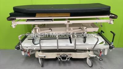 1 x Huntleigh Lifeguard Hydraulic Patient Trolley with Mattress (Hydraulics Tested Working - Mattress Water Damaged) and 1 x Nesbit Evans Hydraulic Patient Examination Trolley with Mattess (Hydraulics Tested Working - Mattress Water Damaged)