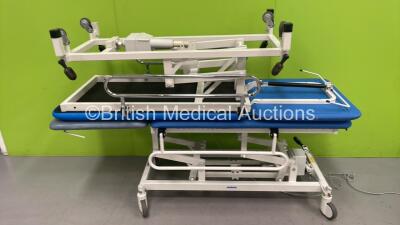 2 x Huntleigh Akron Electric Patient Examination Couch (1 x Powers Up - 1 x Not Power Tested Due to Cut Power Cables)