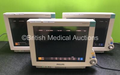 6 x Philips IntelliVue MP70 Patient Monitors *3 in Photo - 6 in Total* (All Power Up with Damage to Casing, 1 x Missing Dial - See Photos)