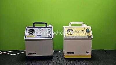 2 x SAM 12 Medical Suction Units (Both Power Up, 1 x Damaged Casing, Missing Gauge and Dial - See Photos) *SN 12152236 / 11132420*