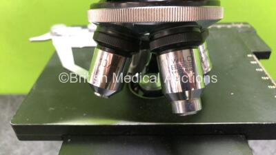 Olympus Wild M20 Benchtop Microscope with 2 x Leitz 10x/18 Eyepieces and 4 x Wild Optics *1 x 10/0,25 / 1 x 40/0,65 / 1 x Hl 50/1,0 and 1 x HL 100/1,25* (Untested Due to Foreign Plug) *SN NA* - 6