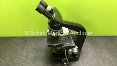 Olympus Wild M20 Benchtop Microscope with 2 x Leitz 10x/18 Eyepieces and 4 x Wild Optics *1 x 10/0,25 / 1 x 40/0,65 / 1 x Hl 50/1,0 and 1 x HL 100/1,25* (Untested Due to Foreign Plug) *SN NA* - 8