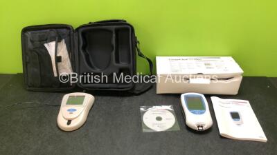 Job Lot Including 1 x Roche CoaguChek XS Pro Blood Coagulation Monitor (Untested Due to No Power Supply, Suspected Flat Battery) with Operators Manual and 1 x Roche CoaguChek S Coagulation Monitor (Powers Up) with Power Supply in Case *SN 0082936 / 010608