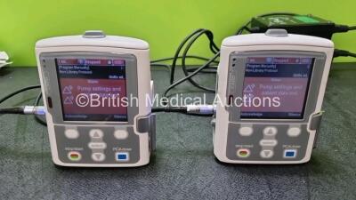 3 x Smiths Medical CADD Model 2110 Ambulatory Infusion Pumps with 3 x Rechargeable Battery Packs (All Power Up) with 2 x Power Supplies, 2 x Keys and 8 x CADD Extension Sets *SN 1031299 / 1031304 / 1031302* (her) - 2