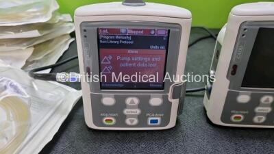 3 x Smiths Medical CADD Model 2110 Ambulatory Infusion Pumps with 3 x Rechargeable Battery Packs (All Power Up) with 2 x Power Supplies, 2 x Keys and 8 x CADD Extension Sets *SN 1031299 / 1031304 / 1031302* (her) - 3