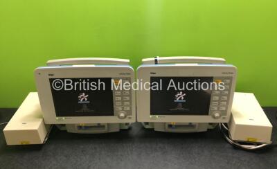 2 x Drager Infinity Delta Patient Monitors with HemoMed 1, Aux/Hemo 3, NBP and MultiMed Options, 2 x Docking Stations and 2 x Power Supplies (Both Power Up) *SN 6000465973 / 6000517472*