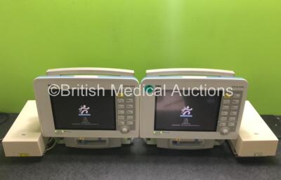 2 x Drager Infinity Delta Patient Monitors with HemoMed 1, Aux/Hemo 3, NBP and MultiMed Options, 2 x Docking Stations and 2 x Power Supplies (Both Power Up, 1 x Damaged Casing / Handle - See Photos) *SN 6000484079 / 6005973967*