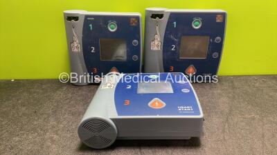 3 x Philips Heartstart FR2+ Defibrillators (2 Power Up, 1 with Fault, 1 No Power)