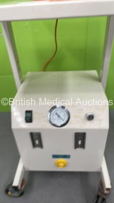 Mixed Lot Including 1 x Seward Examination Light on Stand, 1 x Therapy Equipment Suction Unit on Wheels (Both Power Up) and 1 x Covidien Suction Trolley (No Power) - 4