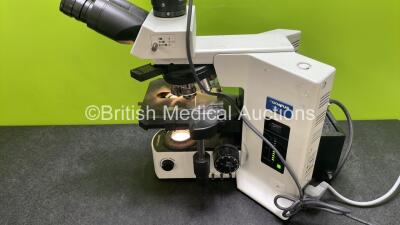 Olympus BX51TF Benchtop Microscope (Powers Up) with 2 x Olympus 10x/22 Eyepieces, 1 x Hitachi HV-C20AMP Camera (Powers Up) and 7 x Optics *1 x Plan 2x/0.05, 1 x UPlan Fl 4x/0.13, 1 x UPlan Fl 10x/0.30, 1 x UPlan Fl 20x/0.50, 1 x UPlan Apo 40x/0.85, 1 x UP - 8