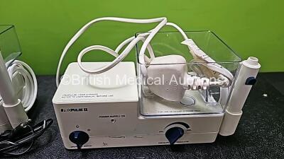 Job Lot Including 3 x Propulse Ear Irrigation Units (1 x with Foot switch, Damaged Handpiece - See Photo, 1 x Missing Container and 3 x Missing Covers), 1 x ProPulse II Ear Irrigation Unit with Missing Cover and 3 x ProPulse II Foot Switches *SN* - 7