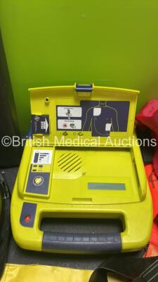 Mixed Lot Including 1 x Cardiac Science Powerheart AED Defibrillator, 1 x Safety Helmet, 1 x Straps, 3 x Belts, 1 x Exeter Special Cushion and a Pair of Size 5 Safety Shoes - 4