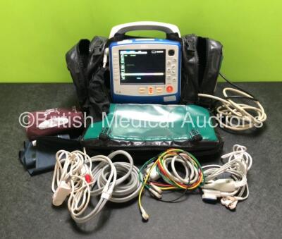 Zoll X Series Monitor / Defibrillator Including ECG, SPO2, NIBP, CO2 and Printer Options Software Version 02.34.05.00 with 1 x Paddle Lead, 1 x Finger Sensor, 2 x Cuffs, 1 x Hose, 2 x ECG Leads and 2 x Sure Power II Batteries in Carry Bag (Powers Up and P