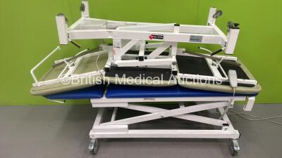 1 x Bristol Maid Electric Patient Examination Couch with Controller (Powers Up) and 1 x Medi-Plinth Electric Patient Examination Couch with No Controller *S/N 13088/1*