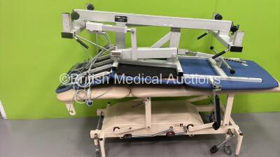 1 x Plinth Co Electric Patient Examination Couch with Controller (Powers Up) and 1 x Nesbit Evan Hydraulic Patient Examination Couch (Hydraulics Tested Working) *S/N 50300DE44*