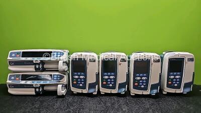 Mixed Lot Including 18 x Carefusion Alaris Guardrails GP Plus Infusion Pumps (3 In Photo - 18 In Total,12 x Cracked Casings), 1 x Carefusion Alaris GP Plus Infusion Pump,1 x CareFusion Alaris Plus GH Syringe Pump and 1 x CareFusion Alaris Guardrails Plus 