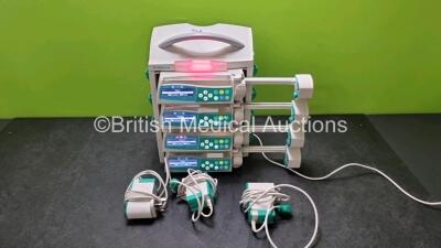 4 x B.Braun Perfusor Space Syringe Pumps (All Power Up) with 1 x B.Braun Space Station, 4 x Pole Clamps and 4 x Power Supplies (3 x Untested Power Supplies) *SN 17469 / 368033 / 368682 / 367988 / 367996*