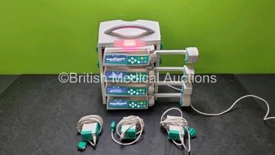 4 x B.Braun Perfusor Space Syringe Pumps (All Power Up) with 1 x B.Braun Space Station, 4 x Pole Clamps and 4 x Power Supplies (3 x Untested Power Supplies) *SN 16303 / 367940 / 367992 / 368759 / 367937*