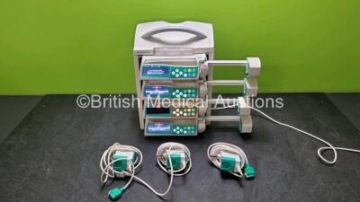 4 x B.Braun Perfusor Space Syringe Pumps (All Power Up) with 1 x B.Braun Space Station, 4 x Pole Clamps and 4 x Power Supplies (3 x Untested Power Supplies)