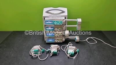 4 x B.Braun Perfusor Space Syringe Pumps (All Power Up) with 1 x B.Braun Space Station, 4 x Pole Clamps and 4 x Power Supplies (3 x Untested Power Supplies) *SN 087554 / 386690 / 367983 / 367961 / 368755*